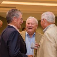 Three men laughing together at Naples 2019
